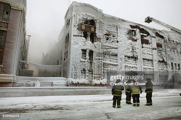 Firefighters work to extinguish a massive blaze at a vacant warehouse on January 23, 2013 in Chicago, Illinois. More than 200 firefighters battled a...