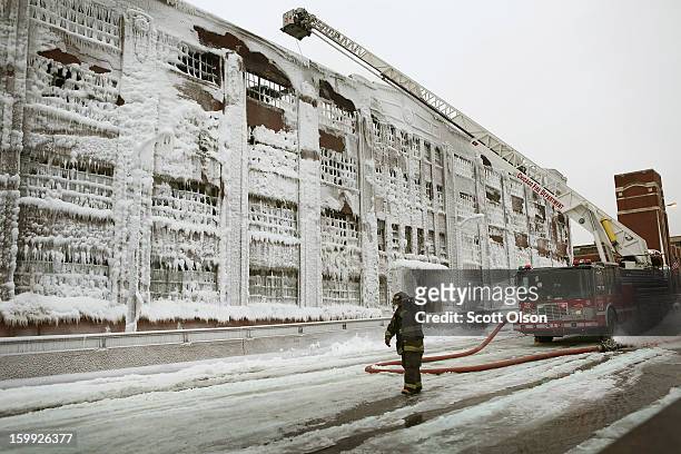 Firefighters work to extinguish a massive blaze at a vacant warehouse on January 23, 2013 in Chicago, Illinois. More than 200 firefighters battled a...