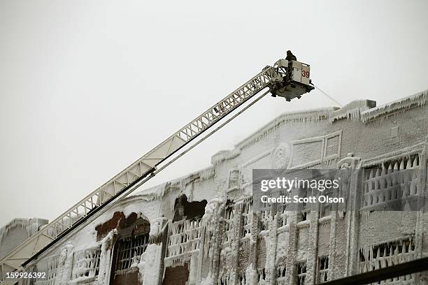 Firefighters work to extinguish a massive blaze at a vacant warehouse on January 23, 2013 in Chicago, Illinois. More than 200 firefighters battled a...