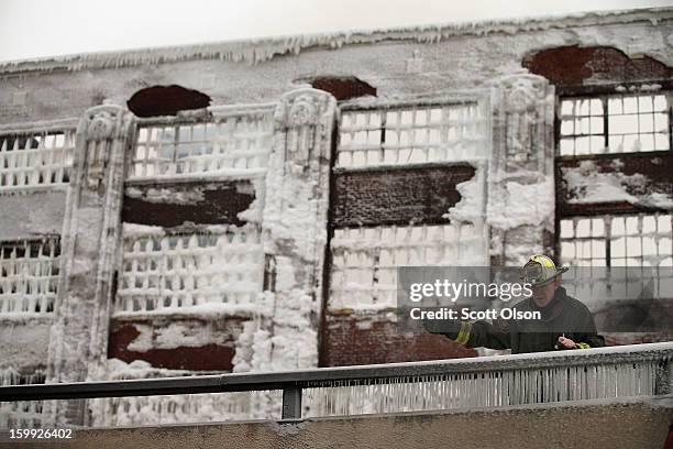 Firefighters work to extinguish a massive blaze at a vacant warehouse on January 23, 2013 in Chicago, Illinois. More than 200 firefighters battled a...