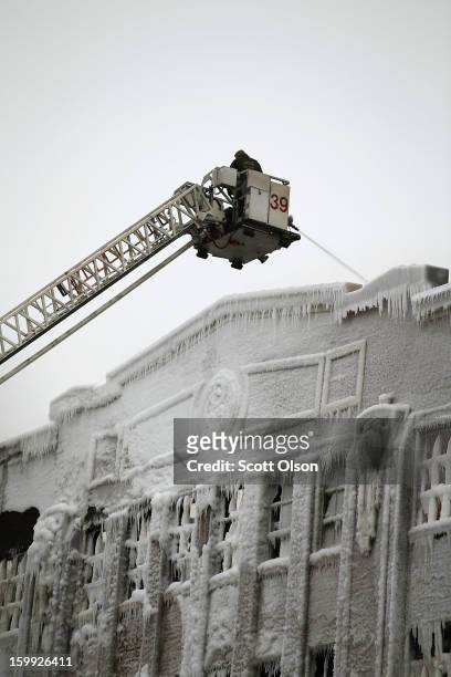 Firefighters work to extinguish a massive blaze at a vacant warehouse on January 23, 2013 in Chicago, Illinois. More than 200 firefighters battled a...