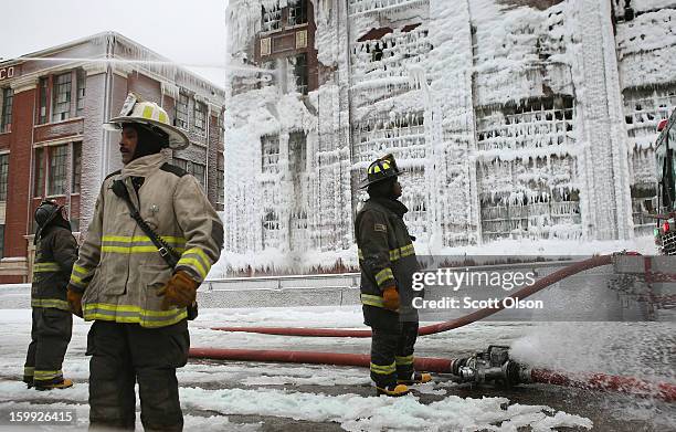 Firefighters work to extinguish a massive blaze at a vacant warehouse on January 23, 2013 in Chicago, Illinois. More than 200 firefighters battled a...