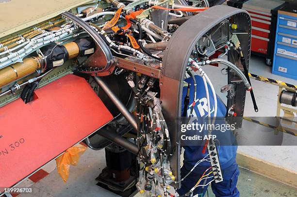 An employee of Franco-Italian aeronautics manufacturer ATR works on an assembly line on January 23, 2013 at the Toulouse factory. ATR registered for...
