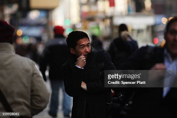 Man tries to keep warm on the street one of the coldest days of the year on January 23, 2013 in New York City. Much of the Northeast, will be...
