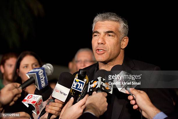 Yair Lapid, leader of the Yesh Atid party, speaks to members of the press outside his house following his unexpectedly strong showing in this week's...