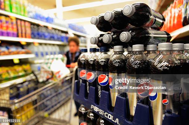 Soft drinks are displayed on the shelf of a local market on January 23, 2013 in Los Angeles, California. According to reports, carbonated soft drink...