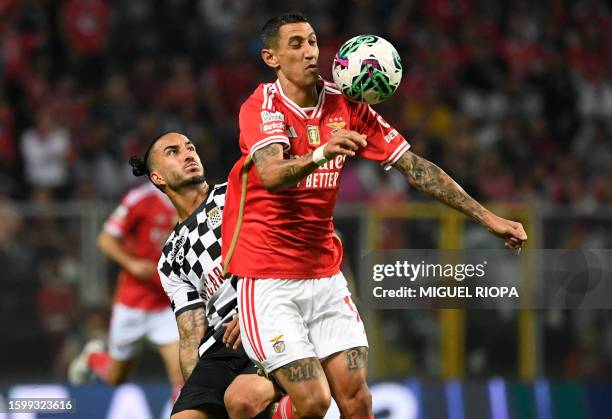 Benfica's Argentinian forward Angel Di Maria vies with Boavista's Colombian midfielder Sebastian Perez during the Portuguese Liga football match...