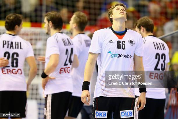 Sven-Soeren Christophersen of Germany looks dejected after losing 24-28 the quarterfinal match between Spain and Germany at Pabellon Principe Felipe...