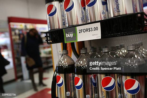 Bottles of soda are displayed on the shelf of a store on January 23, 2013 in New York City. As American consumers continue to shift to water, coffee,...