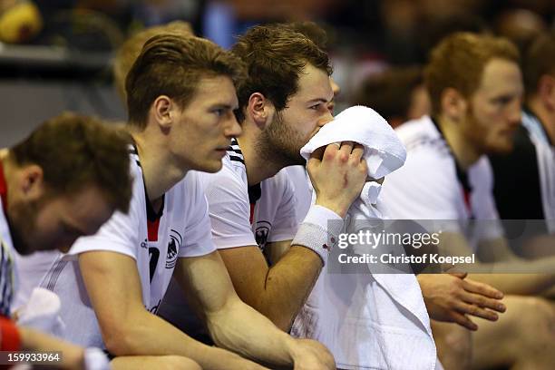 Stefan Kneer and Tobias Reichmann of Germany look dejected during the quarterfinal match between Spain and Germany at Pabellon Principe Felipe Arena...