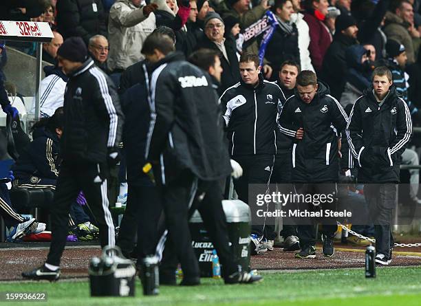 Ball boy walks off of the pitch after being kicked by Eden Hazard of Chelsea who is sent off during the Capital One Cup Semi-Final Second Leg match...