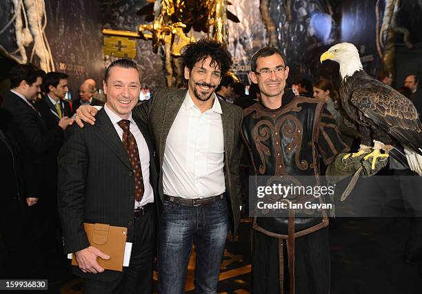 Jean-Marc Pontroue , CEO of Roger Dubuis and friend of the brand, Tomer Sisley pose with an eagle in the booth during the 23rd Salon International de...