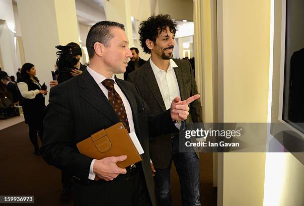 Jean-Marc Pontroue , CEO of Roger Dubuis talks to friend of the brand, Tomer Sisley in the booth during the 23rd Salon International de la Haute...