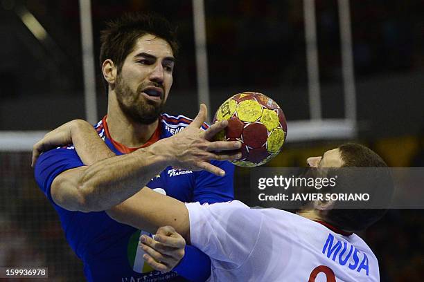 France's centre back Nikola Karabatic vies with Croatia's pivot Zeljko Musa during the 23rd Men's Handball World Championships quarterfinal match...