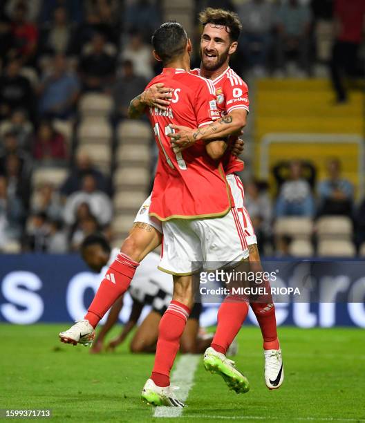 Benfica's Argentinian forward Angel Di Maria celebrates with teammate Benfica's Portuguese midfielder Rafa Silva after scoring a goal during the...