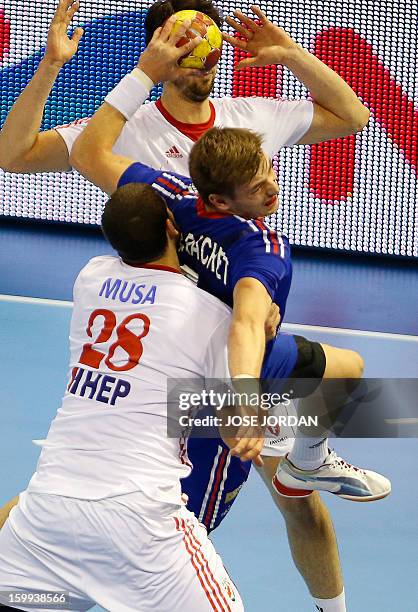 Croatia's pivot Zeljko Musa vies with France's right back Xavier Barachet during the 23rd Men's Handball World Championships quarterfinal match...