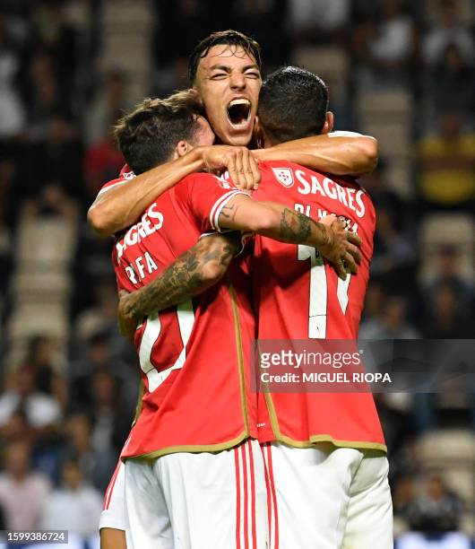 Benfica's Argentinian forward Angel Di Maria celebrates with teammates Benfica's Portuguese midfielder Rafa Silva and Benfica's Croatian forward...