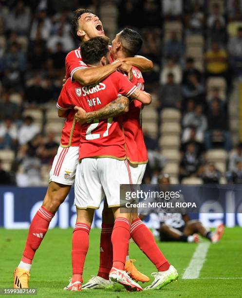 Benfica's Argentinian forward Angel Di Maria celebrates with teammates Benfica's Portuguese midfielder Rafa Silva and Benfica's Croatian forward...