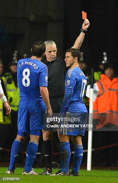 Chelsea's Belgium midfielder Eden Hazard is sent off by referee Chris Foy after an incident involving a ballboy during the English League Cup...