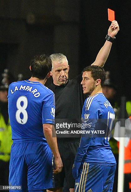 Chelsea's Belgium midfielder Eden Hazard is sent off by referee Chris Foy after an incident involving a ball boy during the English League Cup...