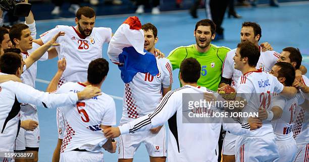 Croatia's players celebrate at the end of the 23rd Men's Handball World Championships quarterfinal match France vs Croatia at the Pabellon Principe...