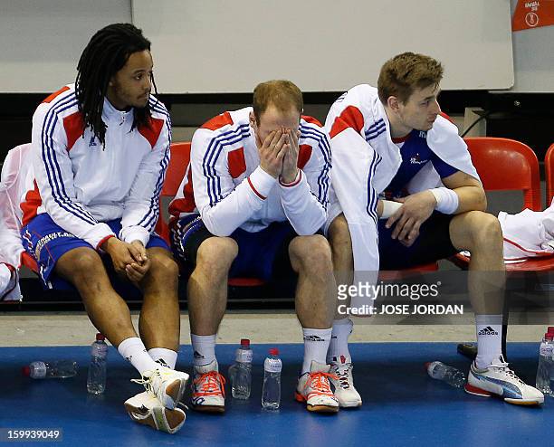 France's players react on the bench during the 23rd Men's Handball World Championships quarterfinal match France vs Croatia at the Pabellon Principe...