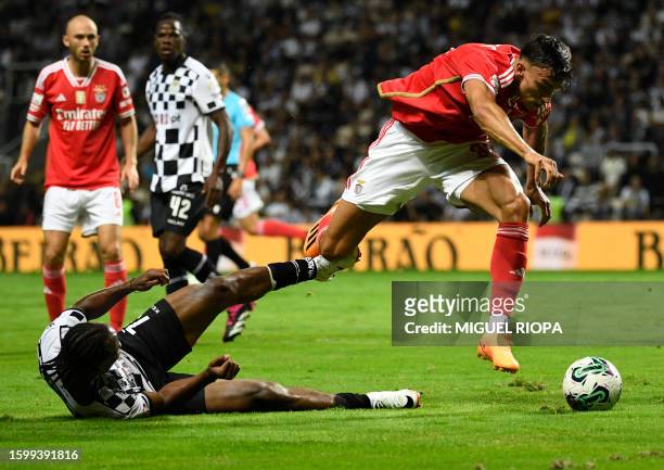 Benfica's Croatian forward Petar Musa vies with Boavista's Nigerian defender Bruno Onyemaechi during the Portuguese Liga football match between...