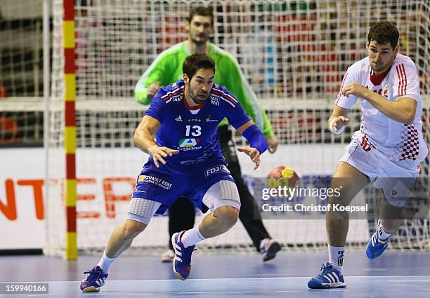 Nikola Karabatic of France and Domagoj Duvnjak of Croatia fight for the ball during the quarterfinal match between France and Croatia at Pabellon...