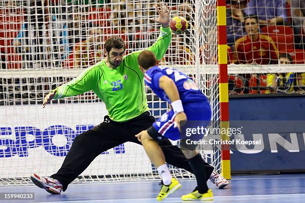 Mirko Alilovic of Croatia saves a seven meter shot of Michael Guigou of France during the quarterfinal match between France and Croatia at Pabellon...