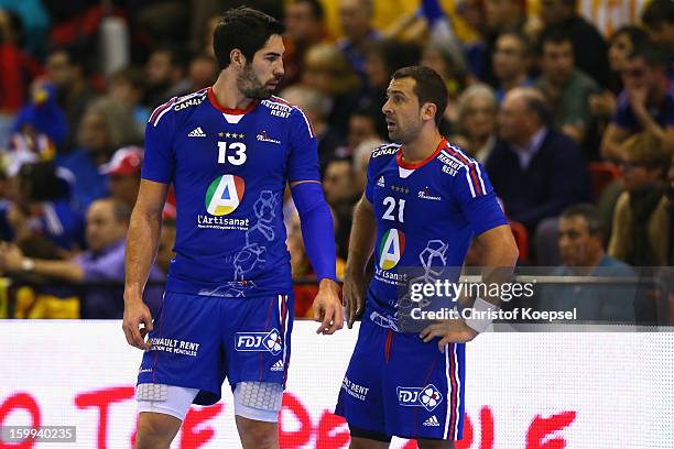 Nikola Karabatic and Michael Guigou of France look dejected during the quarterfinal match between France and Croatia at Pabellon Principe Felipe...