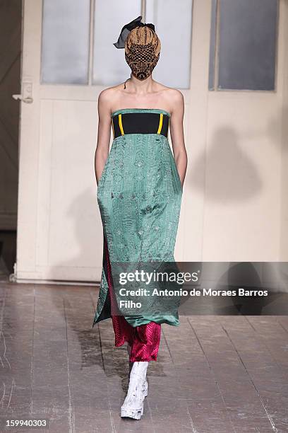 Model walks the runway during the Maison Martin Margiela Spring/Summer 2013 Haute-Couture show as part of Paris Fashion Week at on January 23, 2013...