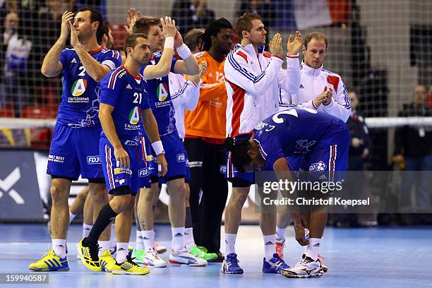 The team of France look dejected after losing 23-30 the quarterfinal match between France and Croatia at Pabellon Principe Felipe Arena on January...