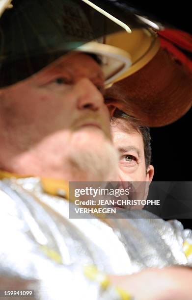 French far-left Parti de Gauche party's leader Jean-Luc Melenchon is pictured beside an ArcelorMittal unionist of Florange plant during a meeting on...