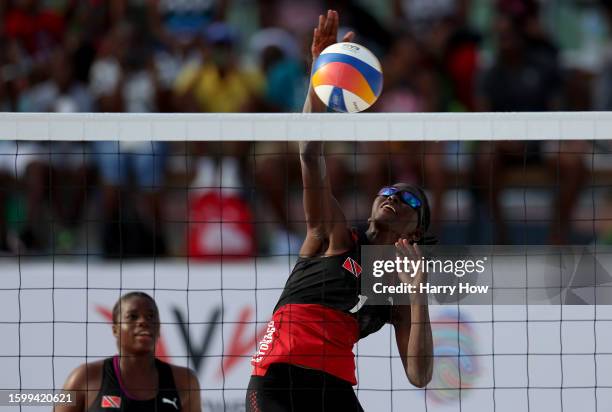 Fe Roberts of Team Trinidad and Tobago competes against Stephanie Joel and Eleno Moule of Team Vanuatu in the Women's Beach Volleyball 9 - 12...