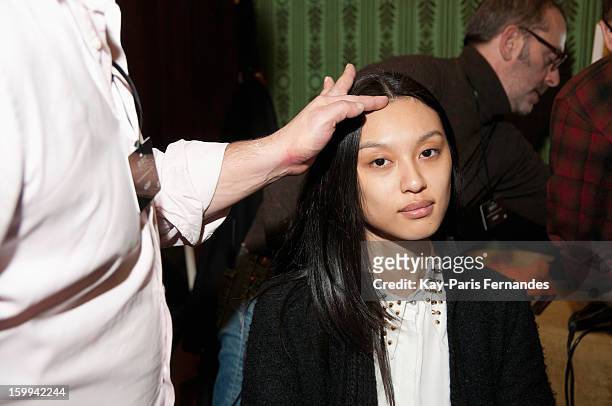 Model has her hair styled backstage at Didit Hediprasetyo Spring/Summer 2013 Haute-Couture show as part of Paris Fashion Week at Shangri-La Hotel...