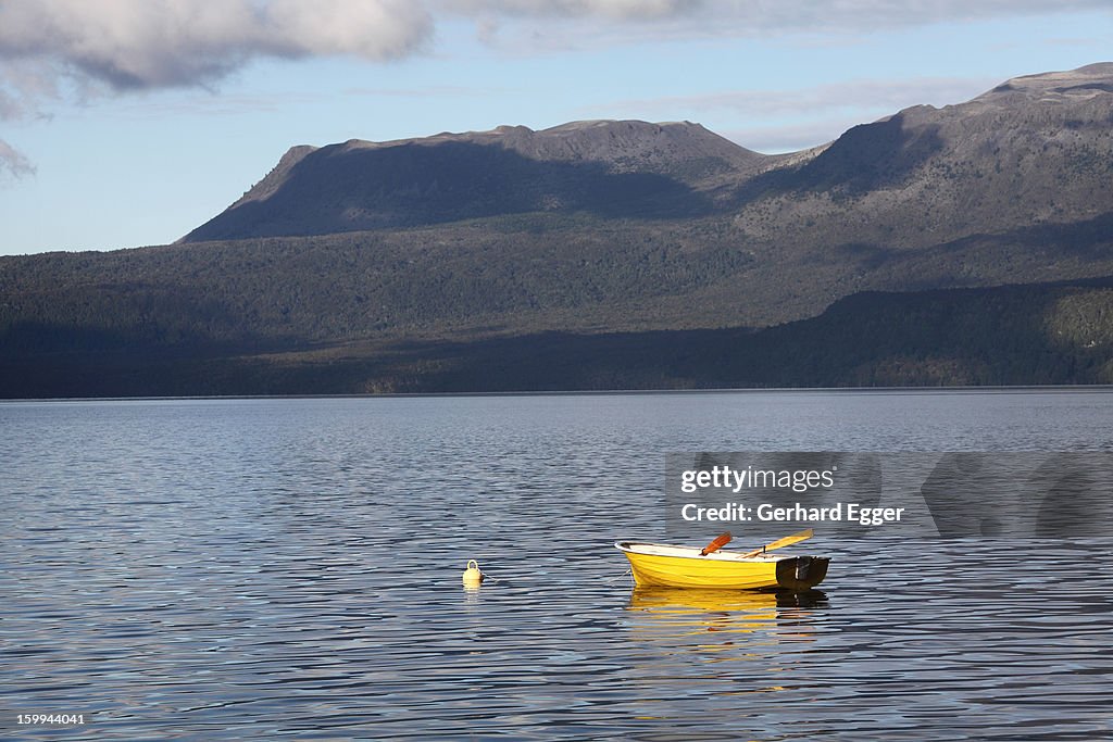 Yellow dinghy on on Lake Tarawera