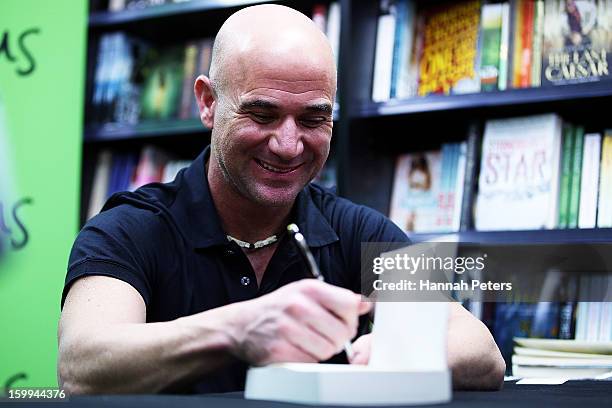 Andre Agassi signs copies of his autobiography, Open, at Paper Plus Newmarket on January 24, 2013 in Auckland, New Zealand.