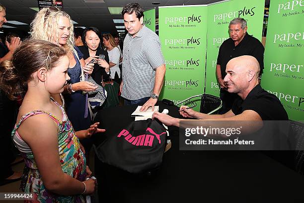 Andre Agassi signs copies of his autobiography, Open, at Paper Plus Newmarket on January 24, 2013 in Auckland, New Zealand.