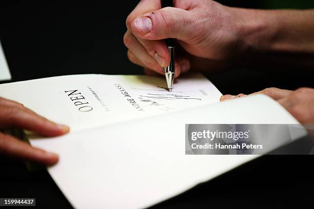 Andre Agassi signs copies of his autobiography, Open, at Paper Plus Newmarket on January 24, 2013 in Auckland, New Zealand.