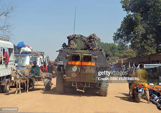 French armoured vehicle patrols in a street of Diabali on January 23, 2013 . French and Malian troops recaptured the frontline towns of Diabaly and...