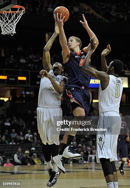 Rob Chubb of the Auburn Tigers goes up for a shot over Kedren Johnson of the Vanderbilt Commodores at Memorial Gym on January 23, 2013 in Nashville,...