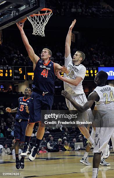 Rob Chubb of the Auburn Tigers goes up for a layup past the defense of Josh Henderson of the Vanderbilt Commodores at Memorial Gym on January 23,...