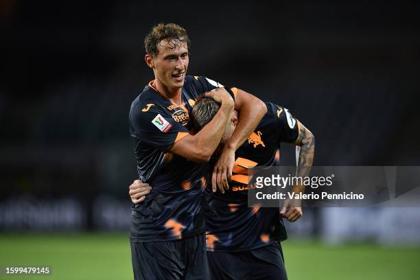 Ivan Ilic of Torino FC celebrates a goal with team mate Mergim Vojvoda during the Coppa Italia Round of 32 match between Torino FC and Feralpisalo at...