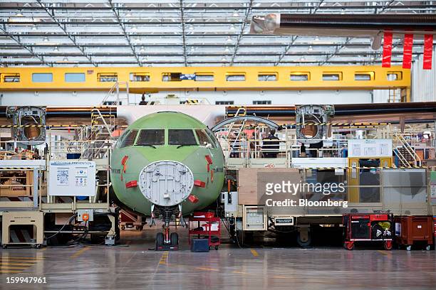 An ATR 72 turboprop aircraft, manufactured by Avions de Transport Regional , stands under construction at the company's production facility in...