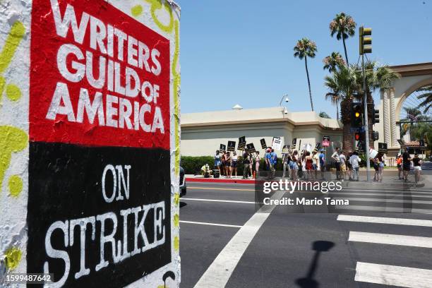 Striking SAG-AFTRA members picket with striking WGA workers outside Paramount Studios on August 7, 2023 in Los Angeles, California. Members of...