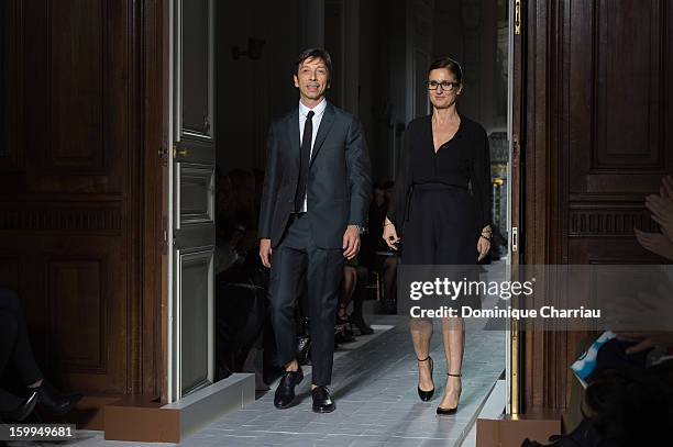 Desiners Pier Piccioli and Maria Grazia Chiuri walk the runway after the Valentino Spring/Summer 2013 Haute-Couture show as part of Paris Fashion...