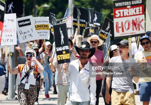 Member Cari Ciotti leads as striking SAG-AFTRA members picket with striking WGA workers outside Paramount Studios on August 7, 2023 in Los Angeles,...