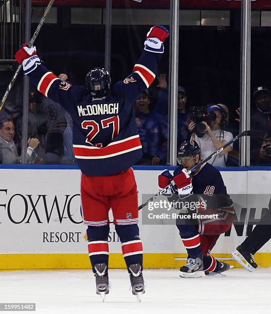 Marian Gaborik of the New York Rangers scores his third goal of the game in overtime to defeat the Boston Bruins, and is joined by Ryan McDonagh at...