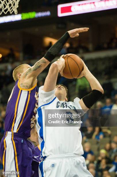 Doug McDermott of the Creighton Bluejays takes the ball to the hoop against Marc Sonnen of the Northern Iowa Panthers during a game at the...