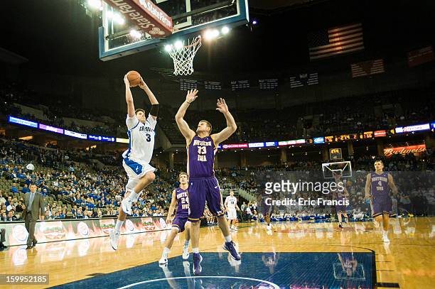 Doug McDermott of the Creighton Bluejays goes up for a shot against Austin Pehl of the Northern Iowa Panthers during their game at the CenturyLink...